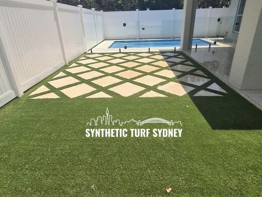 Synthetic turf laid around a swimming pool