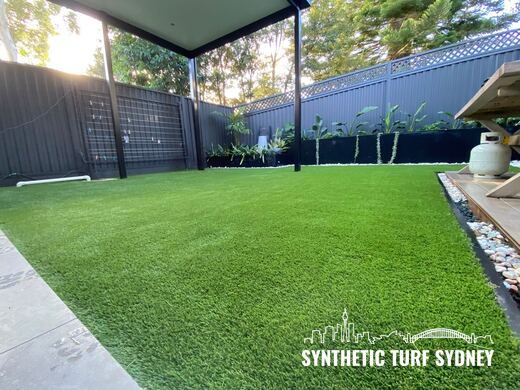 Synthetic lawn installed in a residential backyard