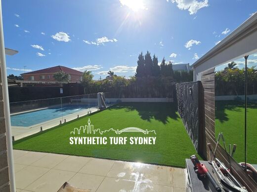 Synthetic turf laid around a swimming pool