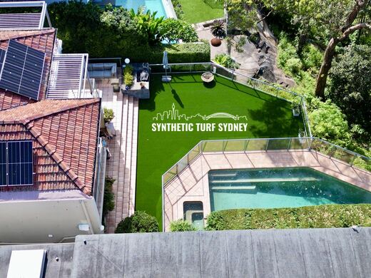 Synthetic turf laid around a swimming pool