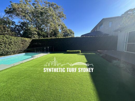 Synthetic turf laid around a swimming pool