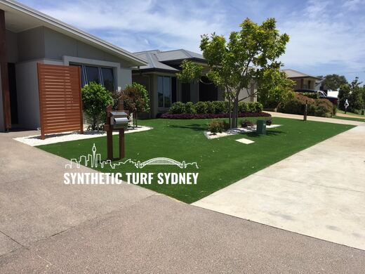 Synthetic lawn installed in a residential backyard