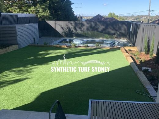 Synthetic lawn installed in a residential backyard