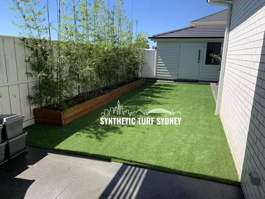 Synthetic lawn installed in a residential backyard
