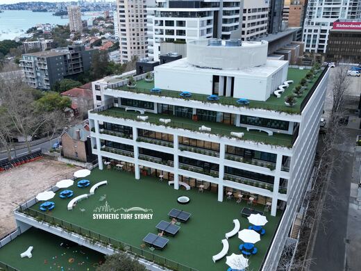 Rooftop common area with seating, laid in STS Commercial synthetic turf