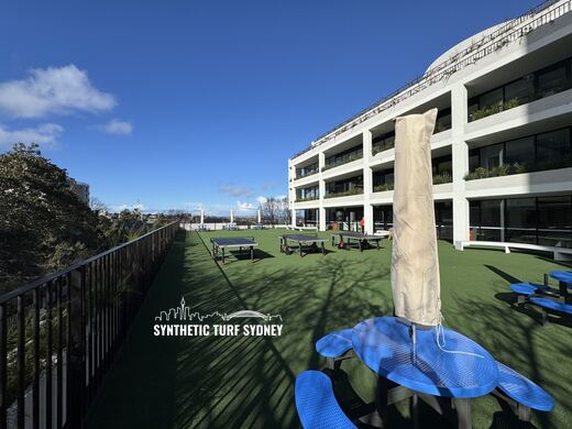 Rooftop common area with seating, laid in STS Commercial synthetic turf