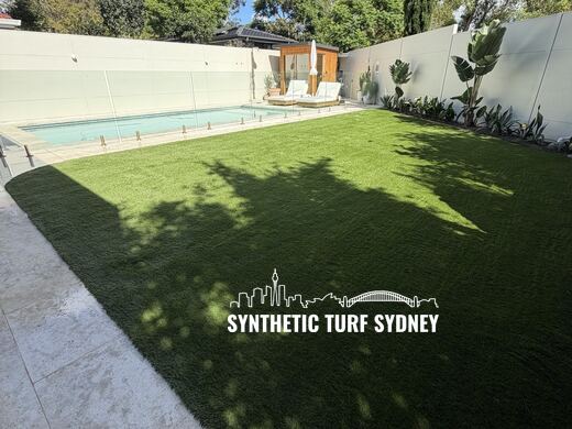 Lawn beside a raised pool, laid in Collaroy 40mm synthetic turf