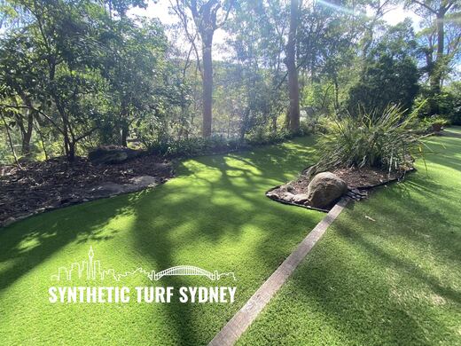 Lawn around a rock outcrop, laid in Hyde Park 40mm synthetic turf