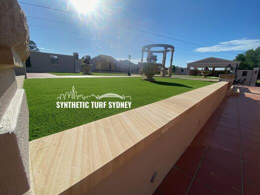 Formal lawn beyond a tiled terrace, laid in Collaroy 40mm synthetic turf