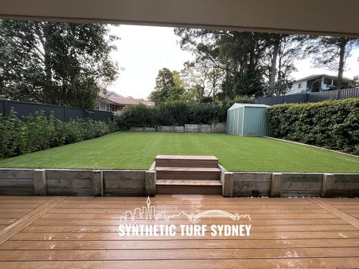 Wide lawn to raised deck, laid in Hyde Park 40mm synthetic turf