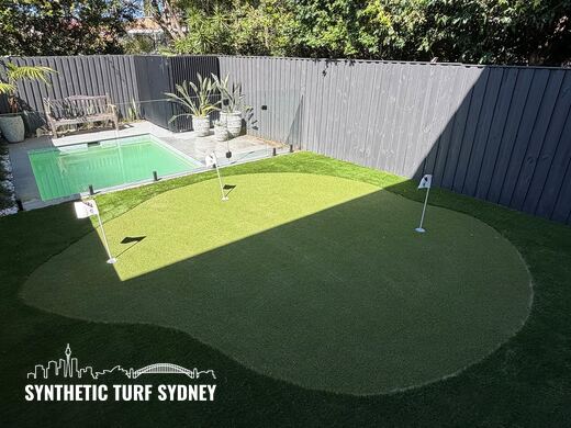 Putting green above a pool fence, laid in STS Putting Turf synthetic turf