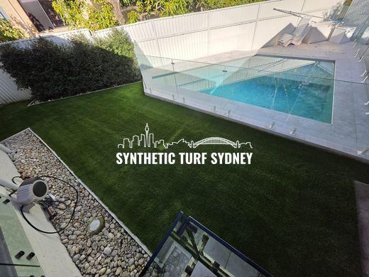 Synthetic turf laid around a swimming pool