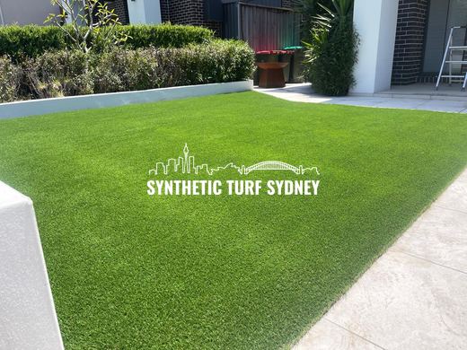 Synthetic lawn installed in a residential backyard