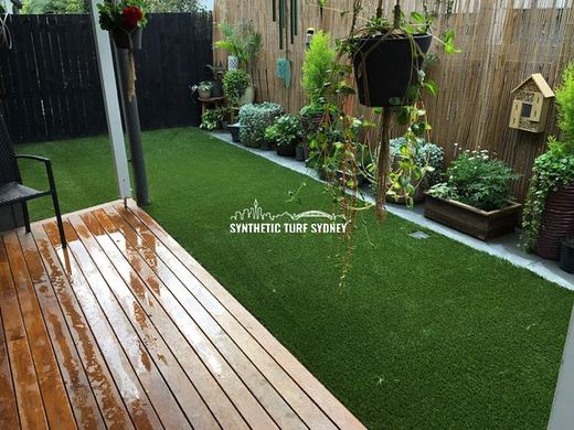 Synthetic lawn installed in a residential backyard
