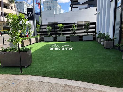 Synthetic lawn installed in a residential backyard