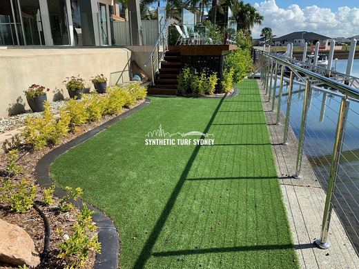 Synthetic lawn installed in a residential backyard
