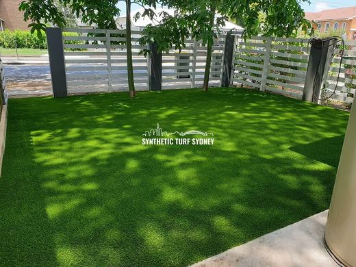 Synthetic lawn installed in a residential backyard