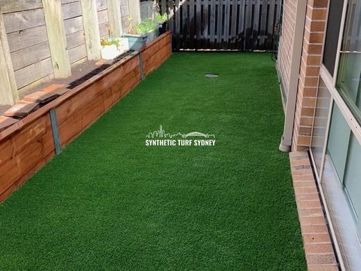 Synthetic lawn installed in a residential backyard