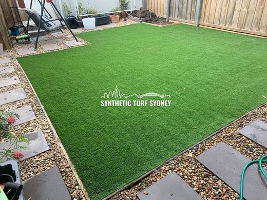 Synthetic lawn installed in a residential backyard