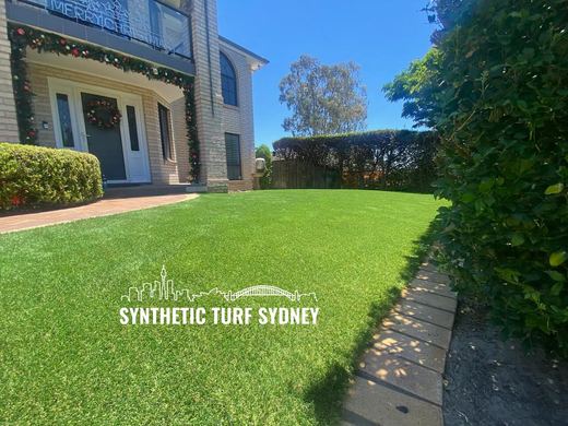 Synthetic lawn installed in a residential backyard