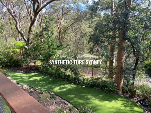 Synthetic lawn installed in a residential backyard