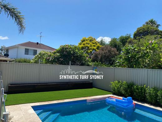 Synthetic turf laid around a swimming pool