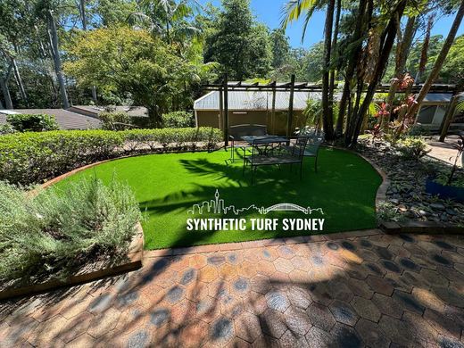 Synthetic lawn installed in a residential backyard
