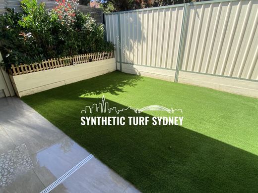 Synthetic lawn installed in a residential backyard