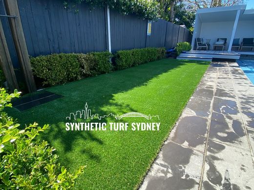Synthetic lawn installed in a residential backyard