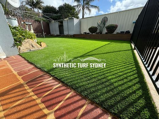Synthetic lawn installed in a residential backyard