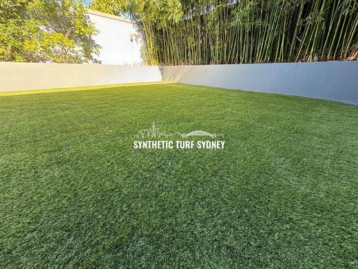 Synthetic lawn installed in a residential backyard