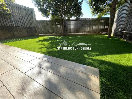 Synthetic lawn installed in a residential backyard