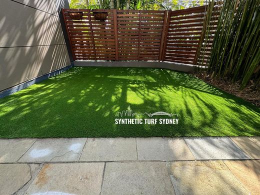 Synthetic lawn installed in a residential backyard