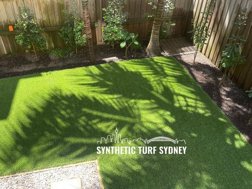 Synthetic lawn installed in a residential backyard