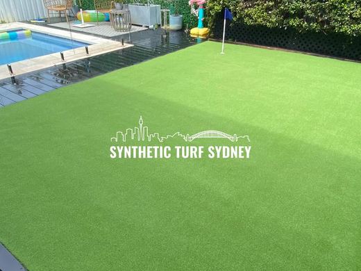 Synthetic turf laid around a swimming pool