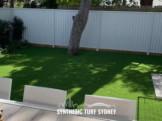Synthetic lawn installed in a residential backyard