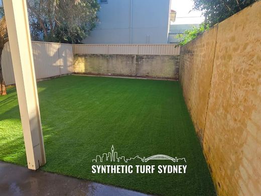 Synthetic lawn installed in a residential backyard