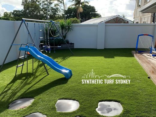 Synthetic lawn installed in a residential backyard