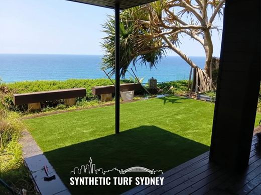 Synthetic lawn installed in a residential backyard