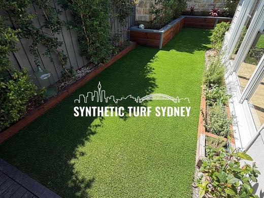 Synthetic lawn installed in a residential backyard