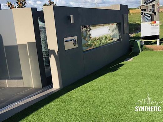 Synthetic lawn installed in a residential backyard