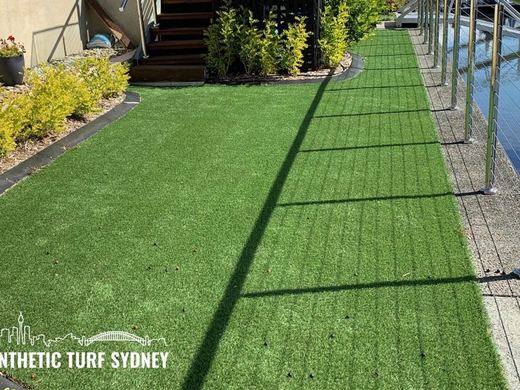 Synthetic lawn installed in a residential backyard