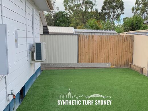 Synthetic lawn installed in a residential backyard