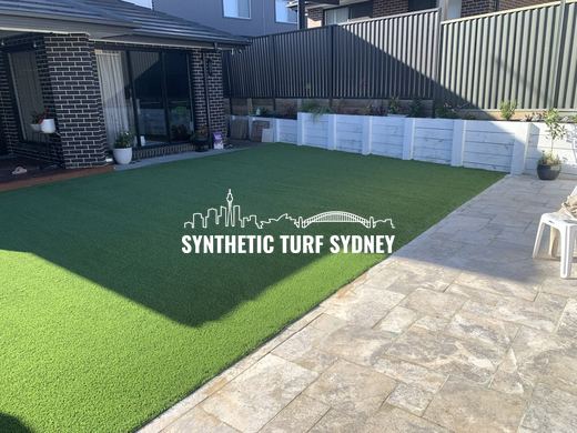 Synthetic lawn installed in a residential backyard