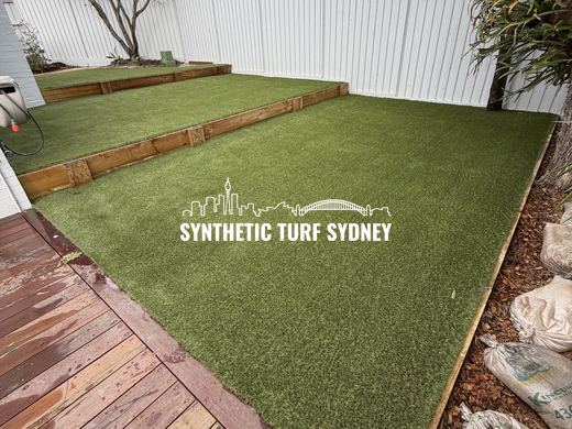 Synthetic lawn installed in a residential backyard