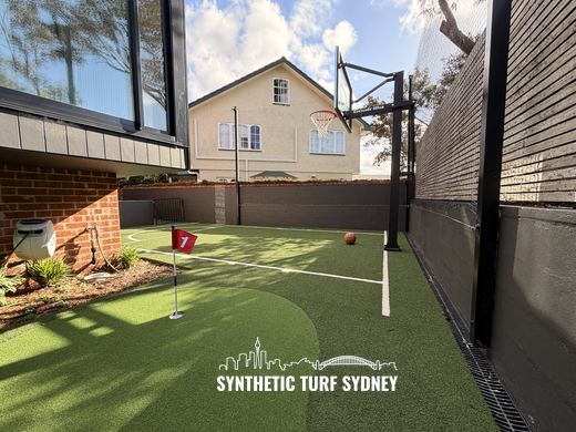 Putting green alongside a basketball court, laid in STS Putting Turf synthetic turf