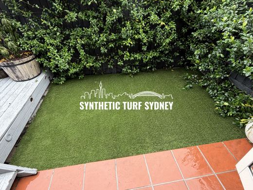 Lawn strip beside a terracotta patio, laid in Collaroy 40mm synthetic turf