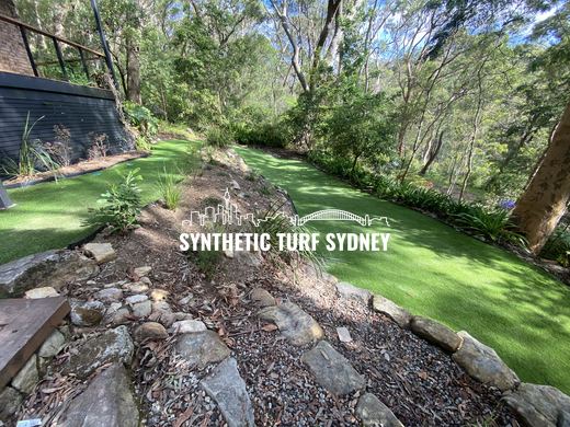 Lawn around a rock outcrop, laid in Hyde Park 40mm synthetic turf