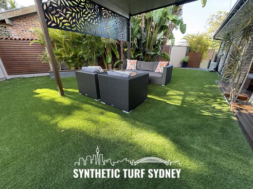 Lawn beside a covered outdoor lounge, laid in Collaroy 40mm synthetic turf